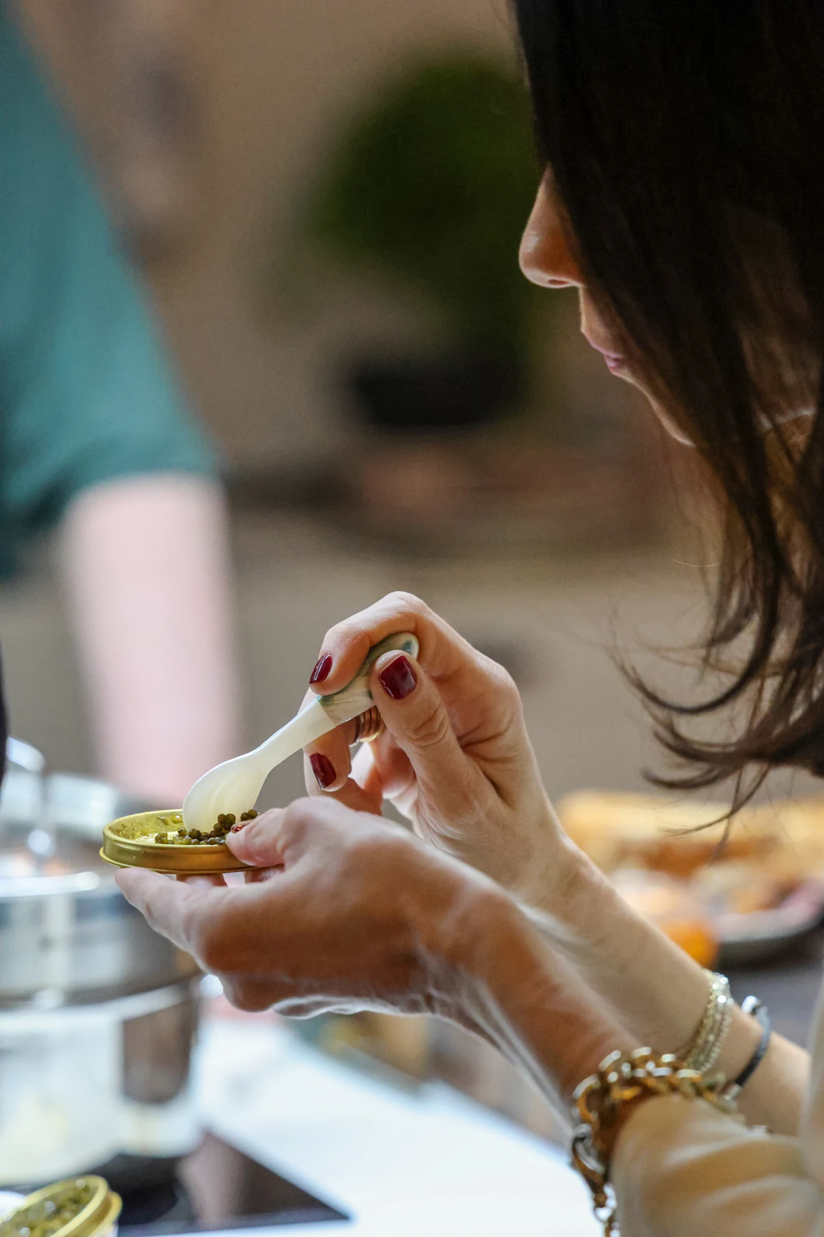A guest trying caviar at a Cofré tasting