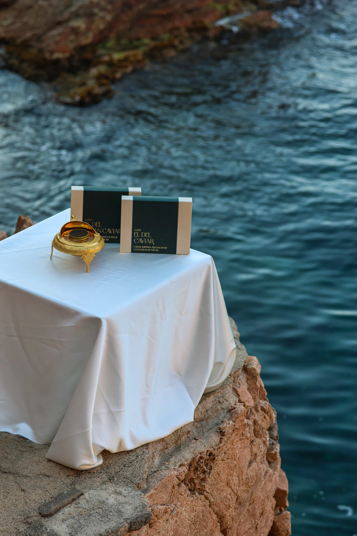 A table set with Cofré by the sea