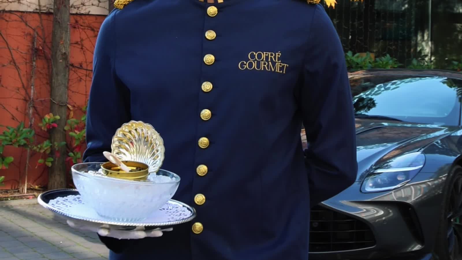 Cofré caviar service beside an Aston Martin